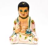 A 20th Century coloured plaster model of a seated Buddah