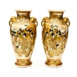 A pair of Japanese Satsuma vases, decorated with gilt details,