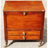 An early 19th Century mahogany lidded Canterbury, fitted with two drawers to base,