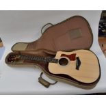 A Taylor 110 CE Guitar with case