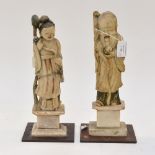 A pair of Chinese 17th century or later soap stone carved figures of immortals,