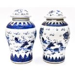 A pair of Chinese blue and white vases and covers,