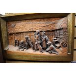 A Black Forest style pinewood carved figurative panel,