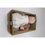 An Armand Marseille bisque head doll, composition body, open mouth with two bottom teeth,