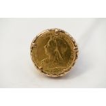 A full Sovereign signet ring, the coin dated 1899 in a 9ct gold mount and shank, gross weight 15.