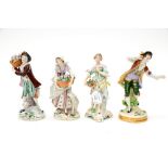 Two Sitzendorf figures, man and woman with flower baskets; with two further Sitzendorf figures,