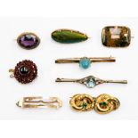 Eight Victorian yellow gold brooches comprising a scarab beetle set agate garnet, green stone,