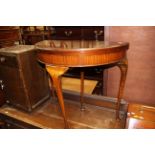 An early 20th Century mahogany fold over card table, of Demilune form,