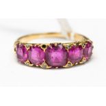 An early 20th century five stone synthetic ruby yellow gold ring,