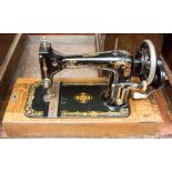 A 1900s New Home D American case sewing machine