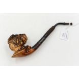 A 19th Century Meerschaum pipe with a carved ladies head, well used with patina and handling wear,