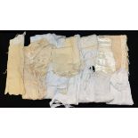 A box of textiles to include children's nightdress and Christening wear,