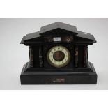 A large French slate clock with marble columns