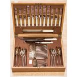 An early 20th century oak cased canteen of cutlery, first, silver plate, by Firth Brearley,