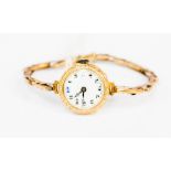 A ladies vintage 9ct gold watch on an expanding 9ct gold bracelet