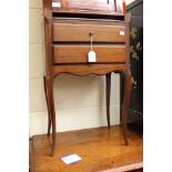 A small mahogany bedside lamp table, in the French taste,