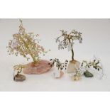 A collection of gemstone trees mounted on quartz and coral mounts (6)