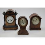 A walnut and ebonised mantle clock, with a maple mantle clock,