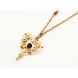 An Edwardian amethyst and seed pearl 9ct gold pendant and chain