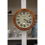 Oak cased circular dial wall clock, dial inscribed Potts,