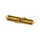 A Victorian Etruscan style sapphire and diamond 15ct yellow gold bar brooch,