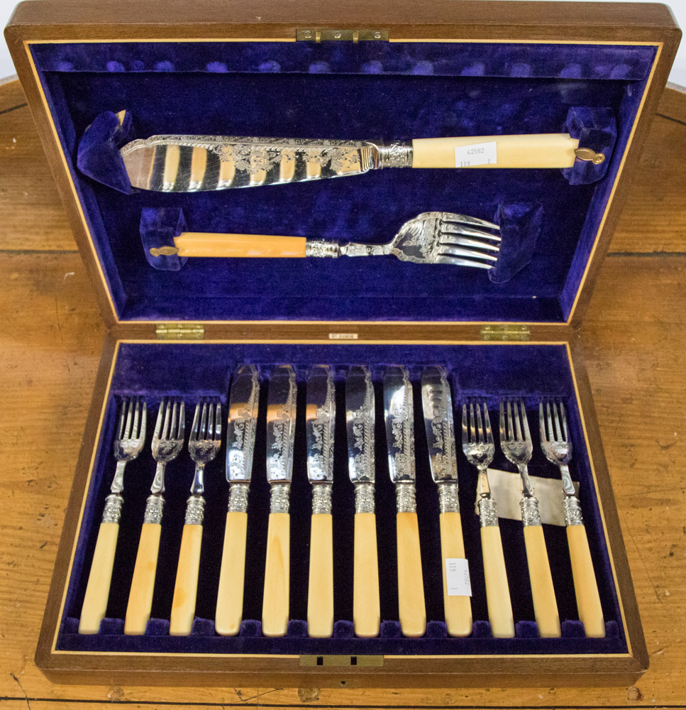 A cased set o six pairs of fish eaters and servers, with bone handles and silver ferrules,