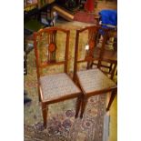 An Edwardian salon suite, comprising chair back settee,