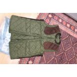 A Barbour Sutherland shooting waistcoat, medium size olive green, as new,