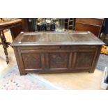 An early 18th Century carved oak blanket chest with candle box inside