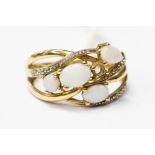 A 9ct gold ring, set with four white opals and diamond chips (a/f) stone missing, finger size T,