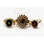 A large garnet cluster ring with overlap setting, set in 9ct gold, size O,