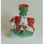 A large Staffordshire cow and calf spill, circa 1890, size approx 27.