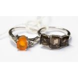 An Ethiopean tangerine and white topaz ring, set in sterling silver,