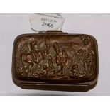 A brass cast wallet with leather interior and village scenes to both sides (1)