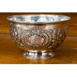 A white metal embossed footed bowl,