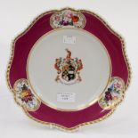 Chamberlains armorial plate with central crest, surrounded by floral sprays,