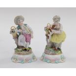 Two Meissen style figures of a girl with spaniel and a boy with flower basket (2)