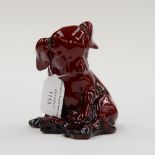 A Royal Doulton flambe seated puppy figure,