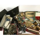 A box containing a collection of assorted costume jewellery, including faux pearl necklaces,