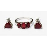 A cherry red opal triplet, three stone ring, silver set, size N, with a pair of matching earrings,