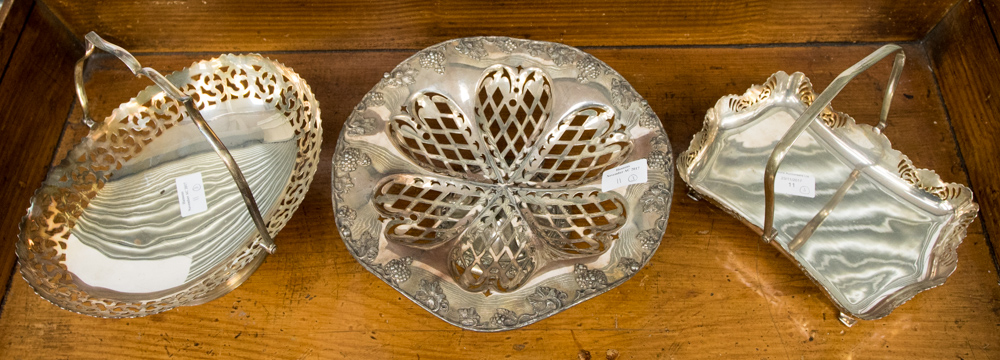 An Edwardian plated grape tazza and two plated handle baskets (3)