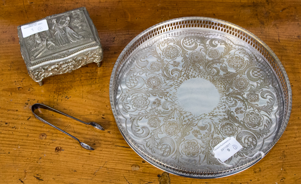 A circular silver plated tray,