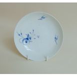 A Pinxton blue and white saucer, sparsely decorated with blue flower sprays, circa 1796-1813,