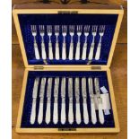 A cased dessert set of ten silver forks, all having mother of pearl handles, Sheffield 1899,