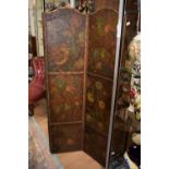 An Art Nouveau four fold leather screen with floral and foliate design in relief,