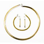 A 9ct yellow and white gold flat snake link collar necklace, bracelet and drop earrings ensuite,