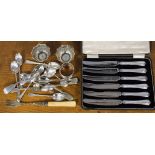 A collection of silver spoons,