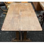 An Arts and Crafts style oak dining table, 77cm high, 167cm wide,