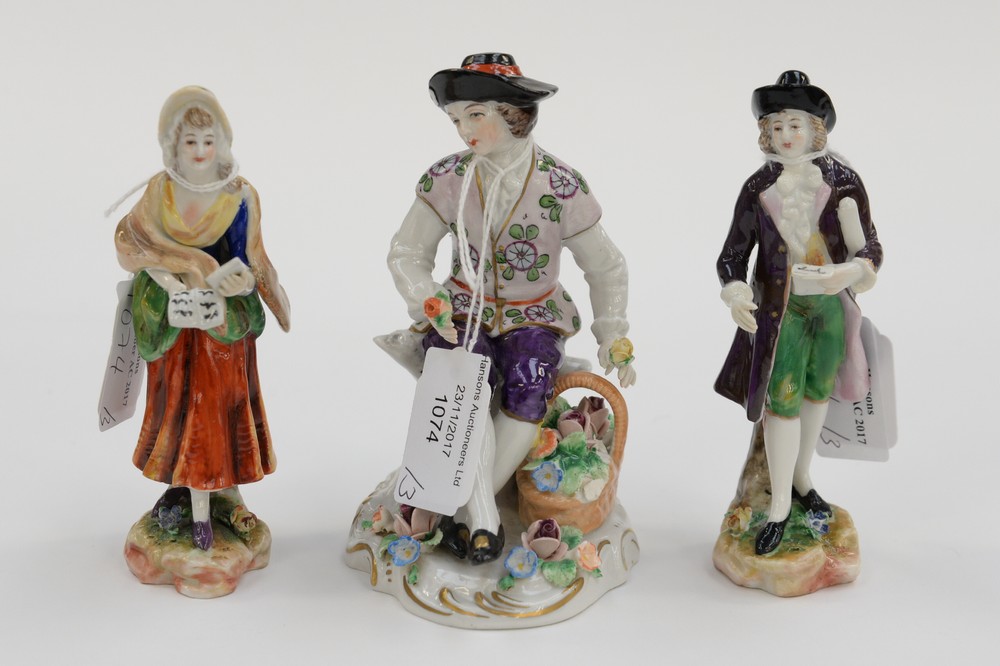 A pair of Continental hard paste figures and a gardener figure (3)