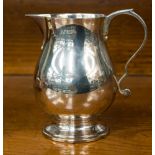 A silver baluster milk jug, London 1972-1973, Wakely and Wheeler,